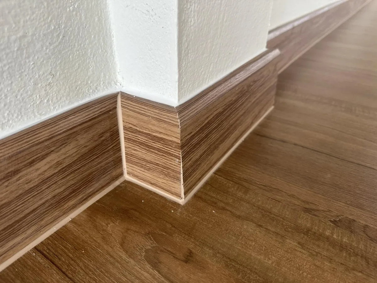 New baseboard trim along the studio floor