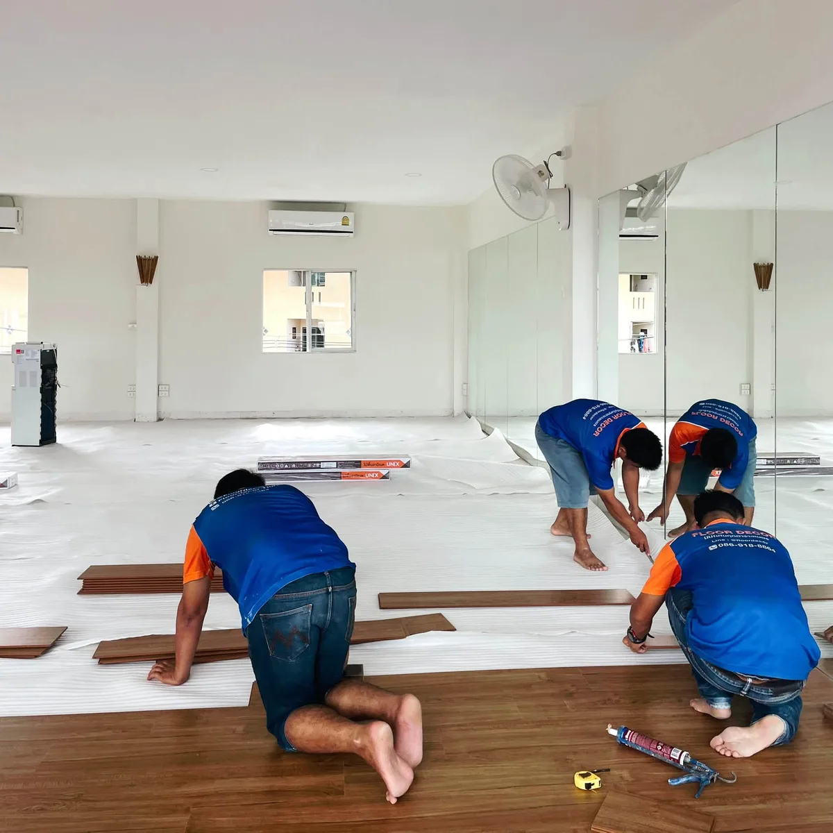 Installation team at work on the studio floor